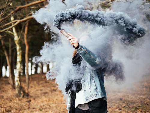 new forest national park person holding gray ash flare standing on brown ground united kingdom